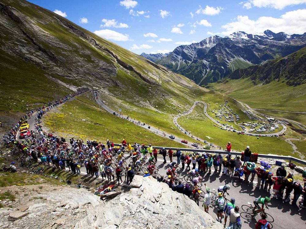 Power Through Riders ascend the Haute Catergorie climb of the Col Agnel on stage 18 of the Tour de France in Galibier, France. Mike Powell 01